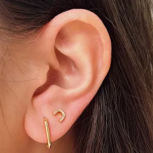 BRINCO ARCO CRAVEJADO. BANHADO A OURO 18K.
