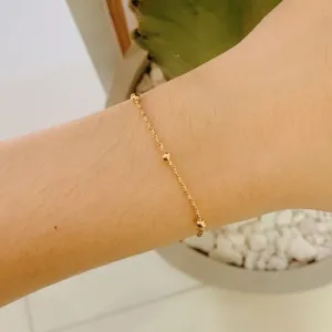 PULSEIRA 6 BOLINHAS COM ELO DUPLO. 16CM DE COMPRIMENTO E 5CM DE REGULAGEM. BANHADA A OURO 18K.