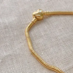 PULSEIRA MOMENTOS DOURADA MALEÁVEL COM FECHO DE CORAÇÃO. BANHADA A OURO 18K.