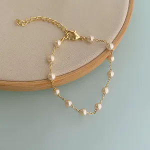 PULSEIRA 12 PÉROLAS. 16CM DE COMPRIMENTO E 5CM DE REGULAGEM. BANHADA A OURO 18K.