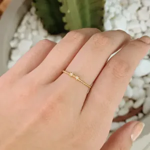 ANEL LACINHO MH COM MEIO ARO EM BOLINHAS. BANHADO A OURO 18K.