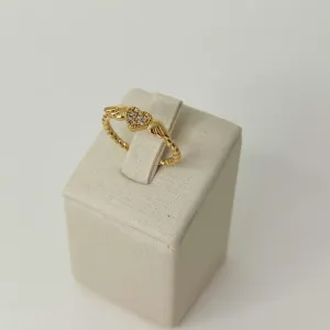 ANEL CORAÇÃO CRAVAJEADO COM ASAS E ARO TORCIDO. BANHADO A OURO 18K.