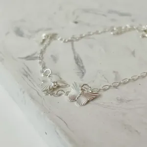 PULSEIRA 3 BORBOLETAS. 18CM DE COMPRIMENTO E 2CM DE REGULAGEM. EM PRATA 925.