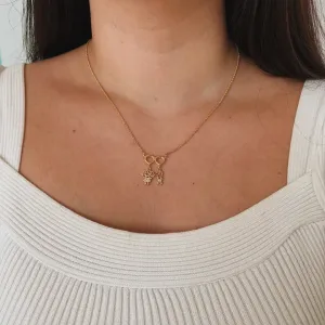 COLAR CASAL DE FILHOS (CORAÇÃO COM 1 MENINO E 1 MENINA CRAVEJADOS). 45CM DE COMPRIMENTO E 5CM DE REGULAGEM. BANHADO A OURO 18K.