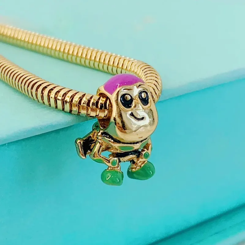 BERLOQUE BUZZ LIGHTYEAR. BANHADO A OURO 18K.