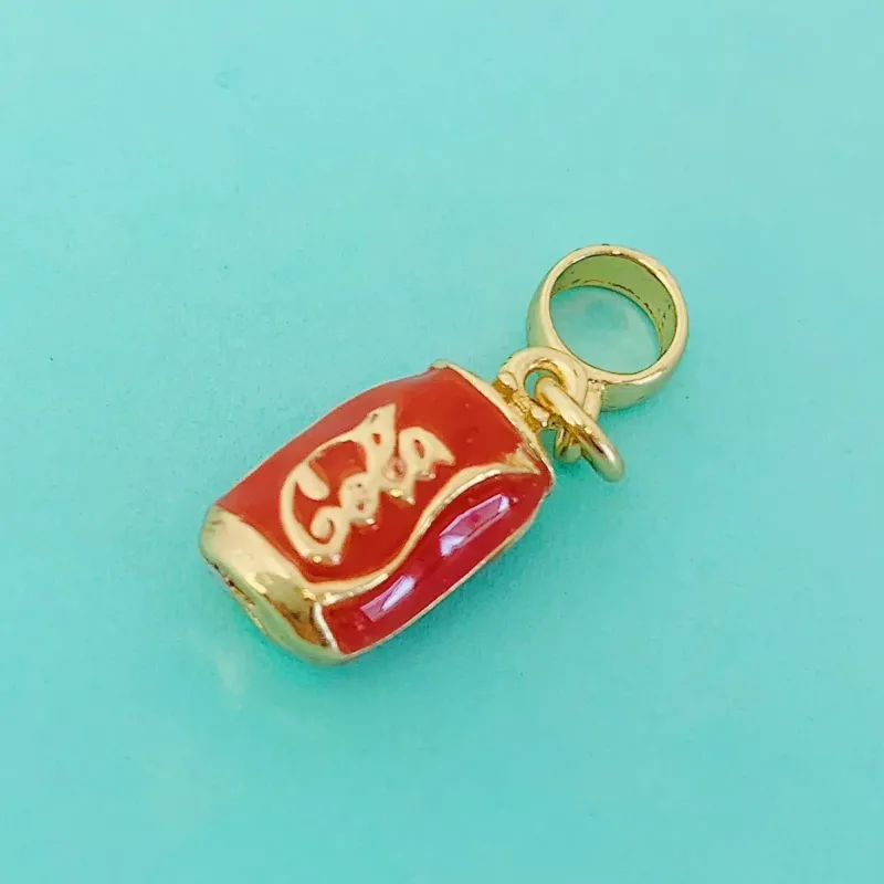 BERLOQUE COCA COLA. BANHADO A OURO 18K.
