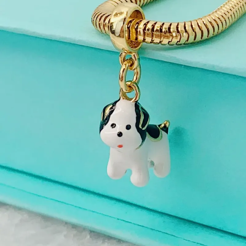 BERLOQUE LULY (CACHORRINHO). BANHADO A OURO 18K.