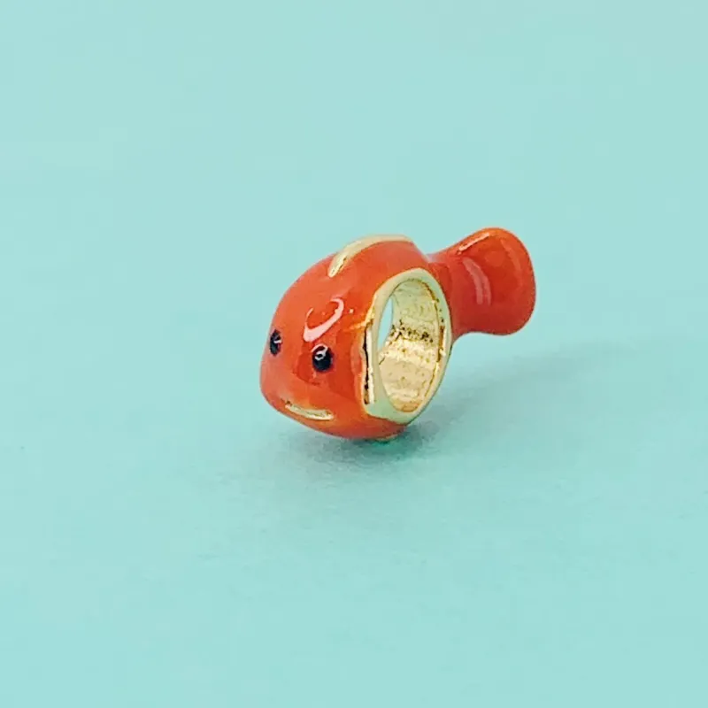 BERLOQUE NEMO. BANHADO A OURO 18K.