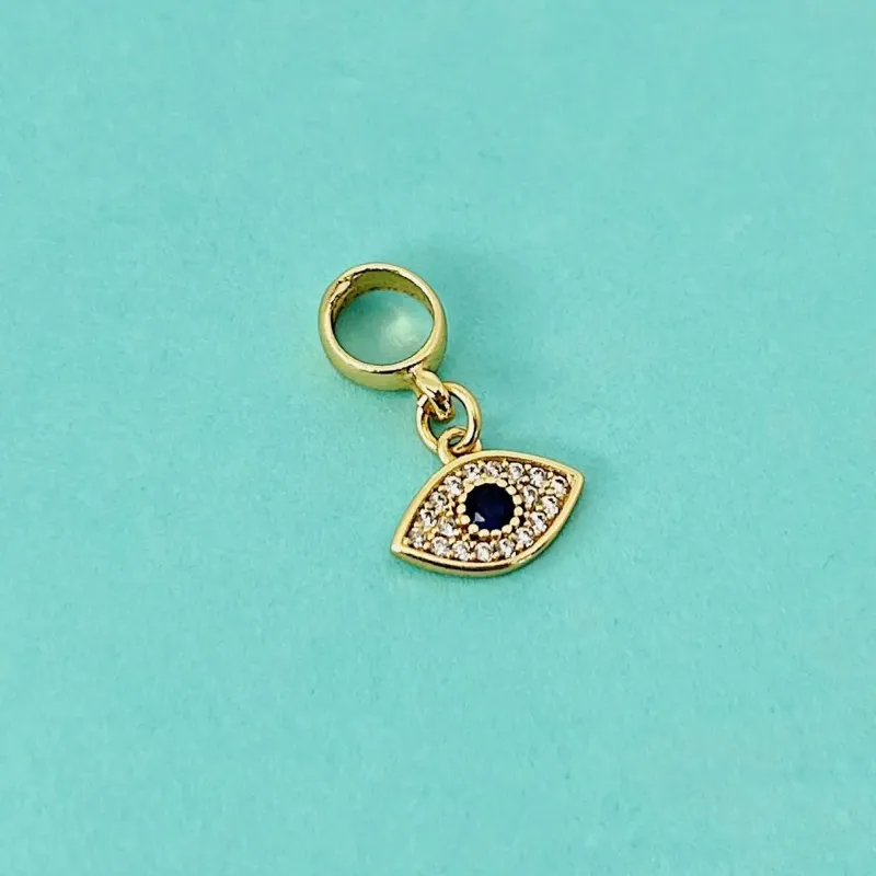 BERLOQUE OLHO GREGO CRAVEJADO. BANHADO A OURO 18K.