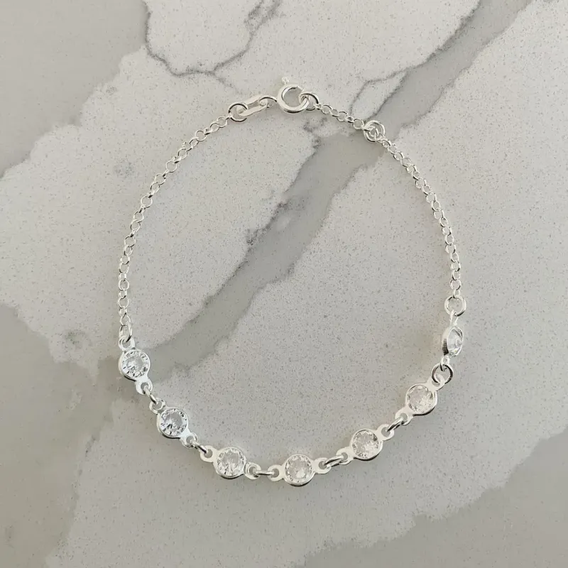PULSEIRA 7 ZIRCÔNIAS.18CM DE COMPRIMENTO E 1CM DE REGULAGEM. EM PRATA 925.