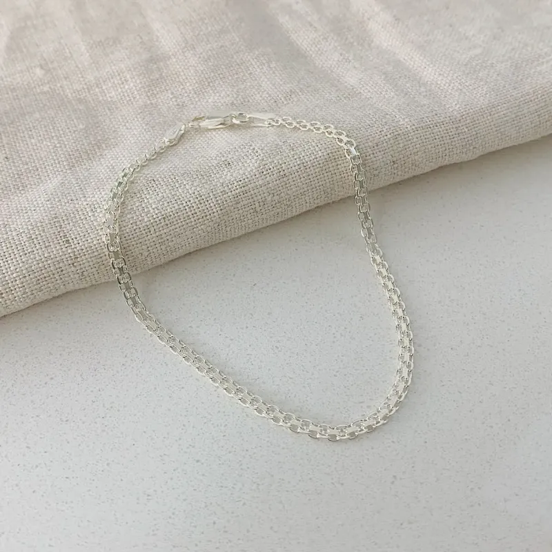 PULSEIRA ESTEIRA TRANÇADA. 18,5CM DE COMPRIMENTO. EM PRATA 925.