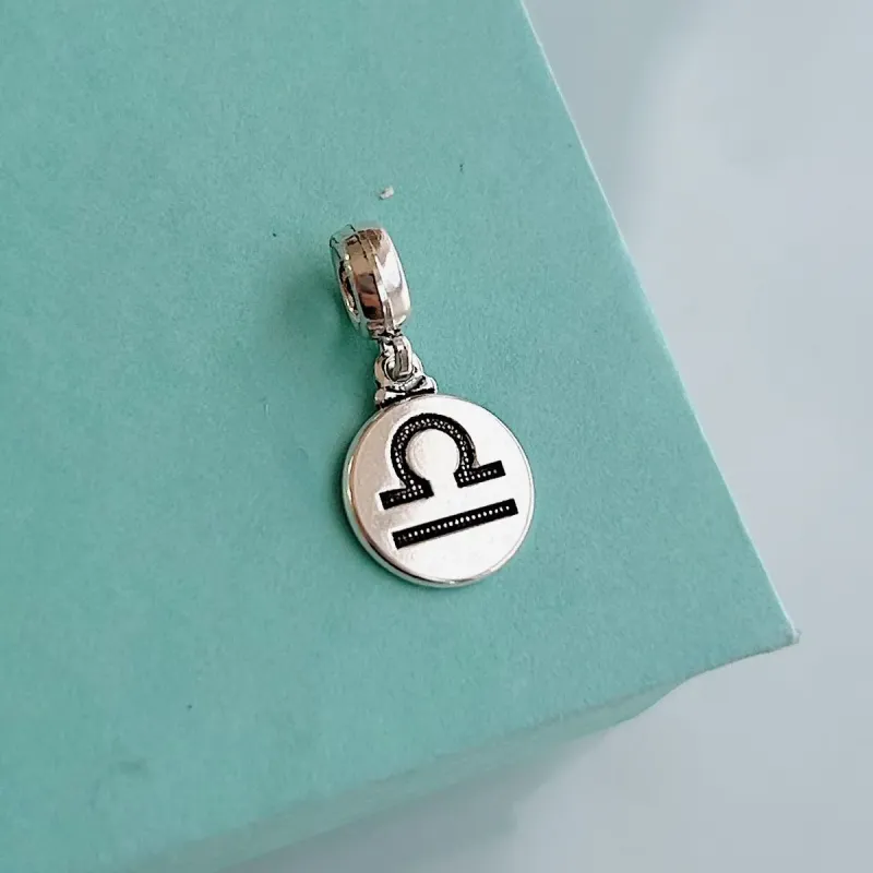 BERLOQUE SIGNO LIBRA. EM PRATA 925.