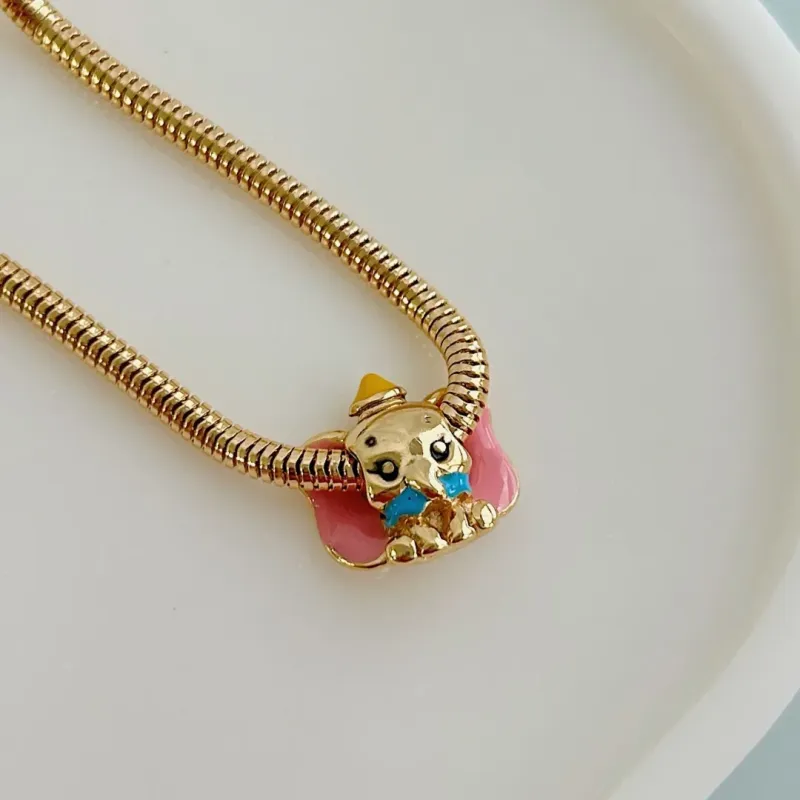 BERLOQUE SEPARADOR DUMBO. BANHADO A OURO 18K.