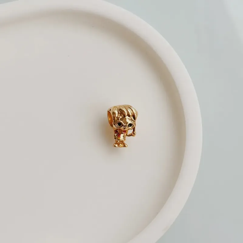 BERLOQUE SEPARADOR HARRY POTTER. BANHADO A OURO 18K.