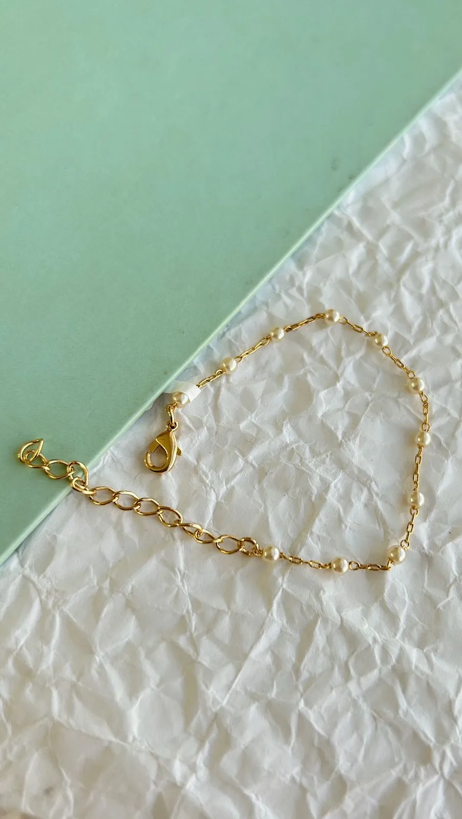PULSEIRA INFANTIL PÉROLA. 13CM DE COMPRIMENTO + 5CM DE REGULAGEM.