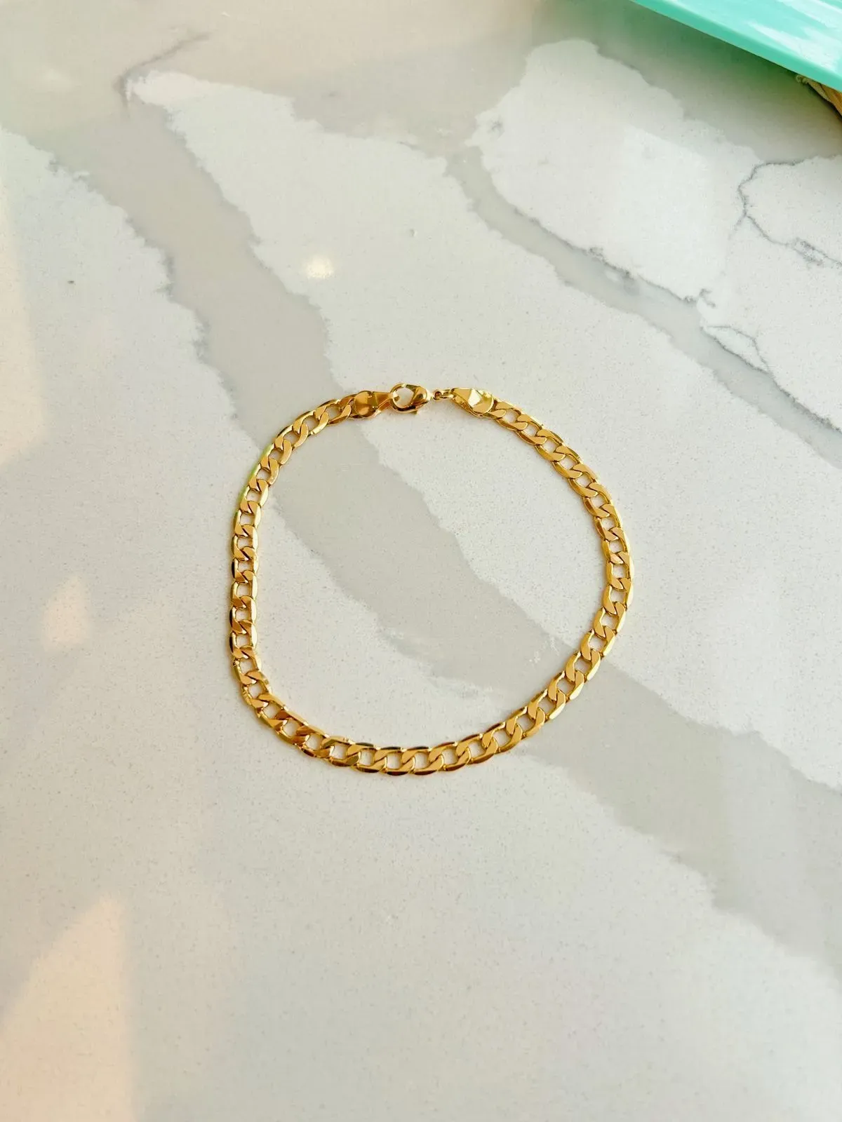 PULSEIRA MASCULINA GRUMÊ COM 5MM DE ESPESSURA. 21CM DE COMPRIMENTO. BANHADA A OURO 18K.
