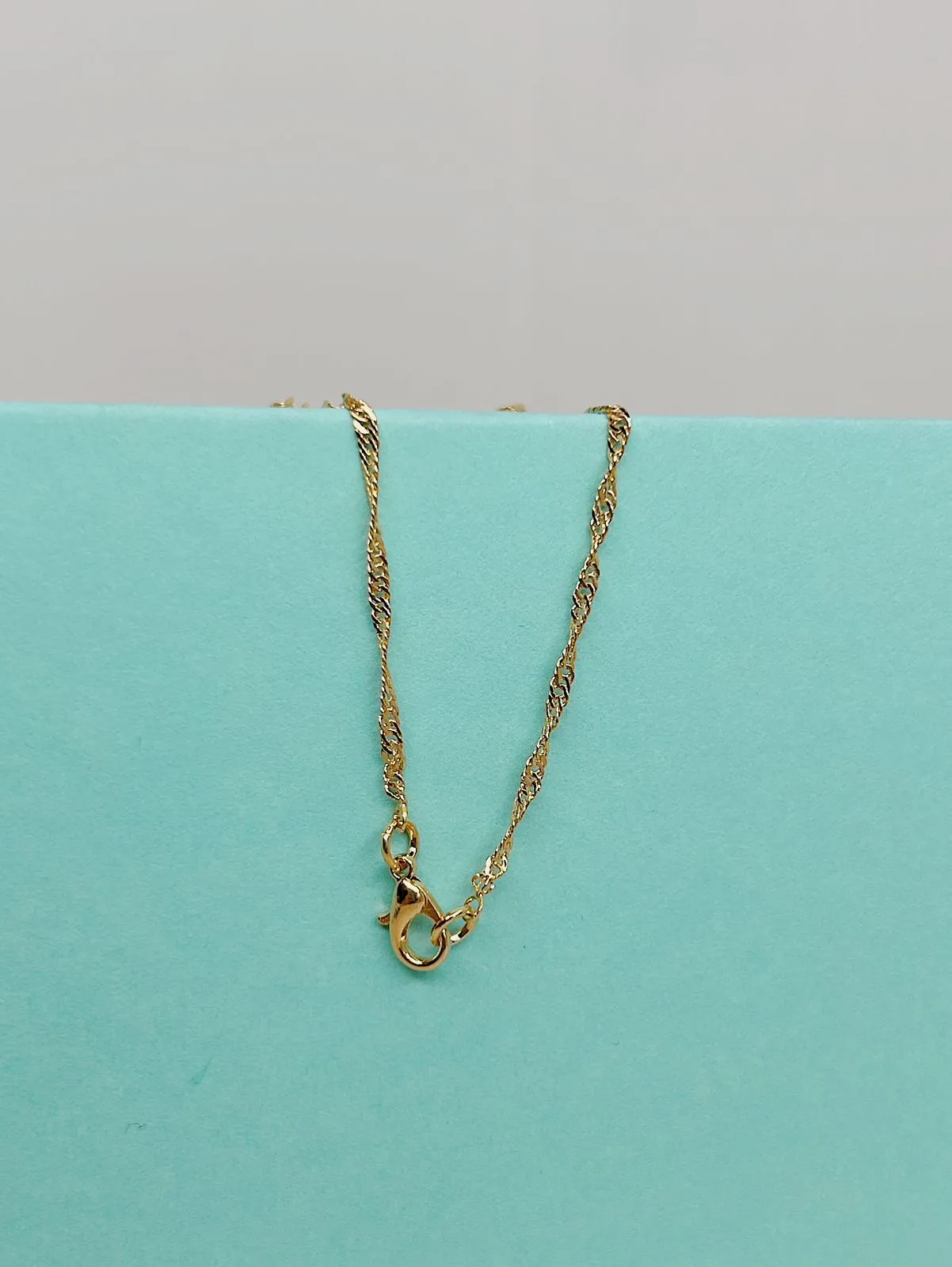 COLAR SINGAPURA. 50CM DE COMPRIMENTO. BANHADO A OURO 18K.