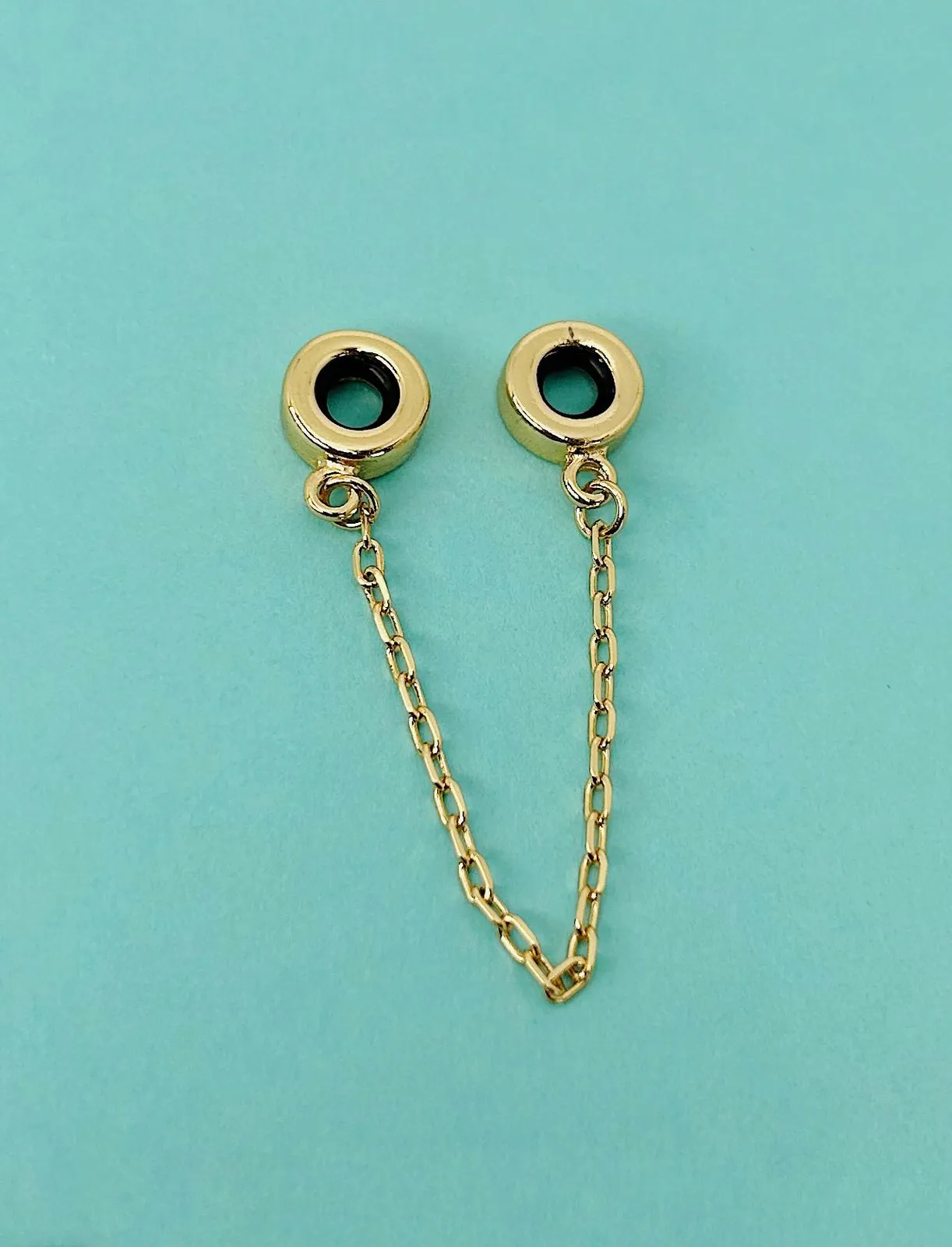 BERLOQUE PEGA LADRÃO TRADICIONAL. BANHADO A OURO 18K.