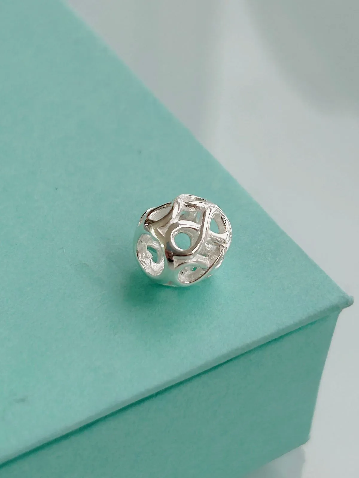 BERLOQUE SEPARADOR OVAL COM INFINITOS. EM PRATA 925.
