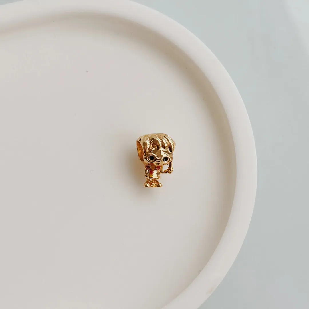 BERLOQUE SEPARADOR HARRY POTTER. BANHADO A OURO 18K.