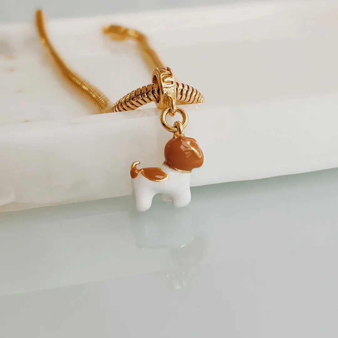 BERLOQUE SHITZU. BANHADO A OURO 18K.