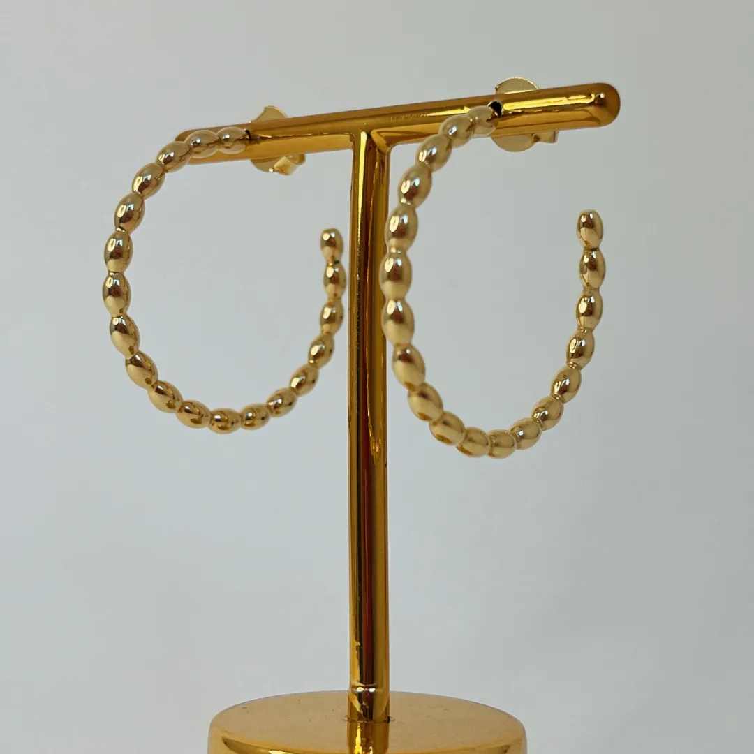 ARGOLA GOMINHOS. BANHADA  A OURO 18K.