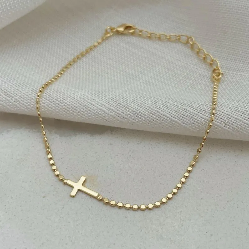 PULSEIRA BOLINHAS ACHAT COM CRUZ HORIZ. 17CM DE COMPRIMENTO E 5CM DE REGULAGEM. BANHADO A OURO 18K.