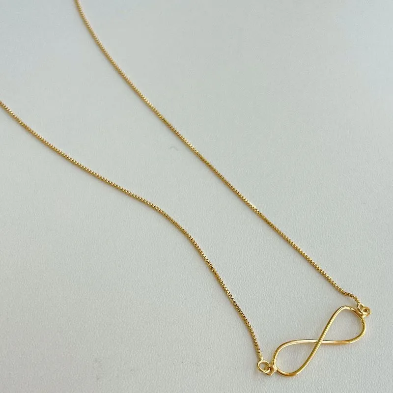 COLAR  INFINITO. 45CM DE COMPRIMENTO E 5CM DE REGULAGEM. BANHADO A OURO 18K.