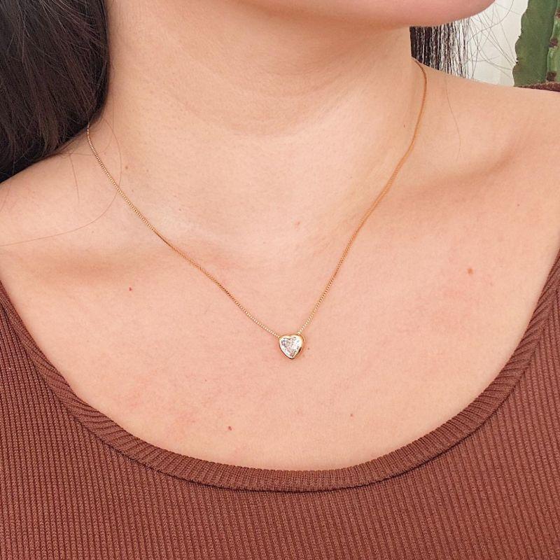 COLAR COM PONTO DE LUZ CORAÇÃO 8MM. 45CM DE COMPRIMENTO E 5CM DE REGULAGEM. BANHADO A OURO 18K.